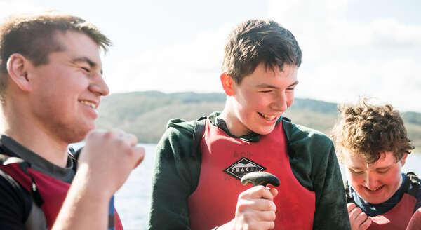 Scouts chatting on the water